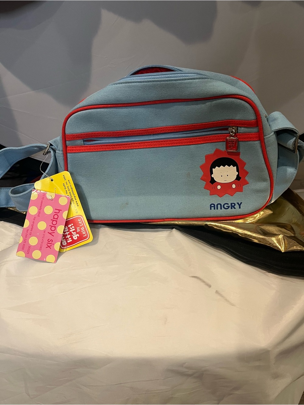 Light Blue Kids Crossbody Bag with Playful 'Angry' Character